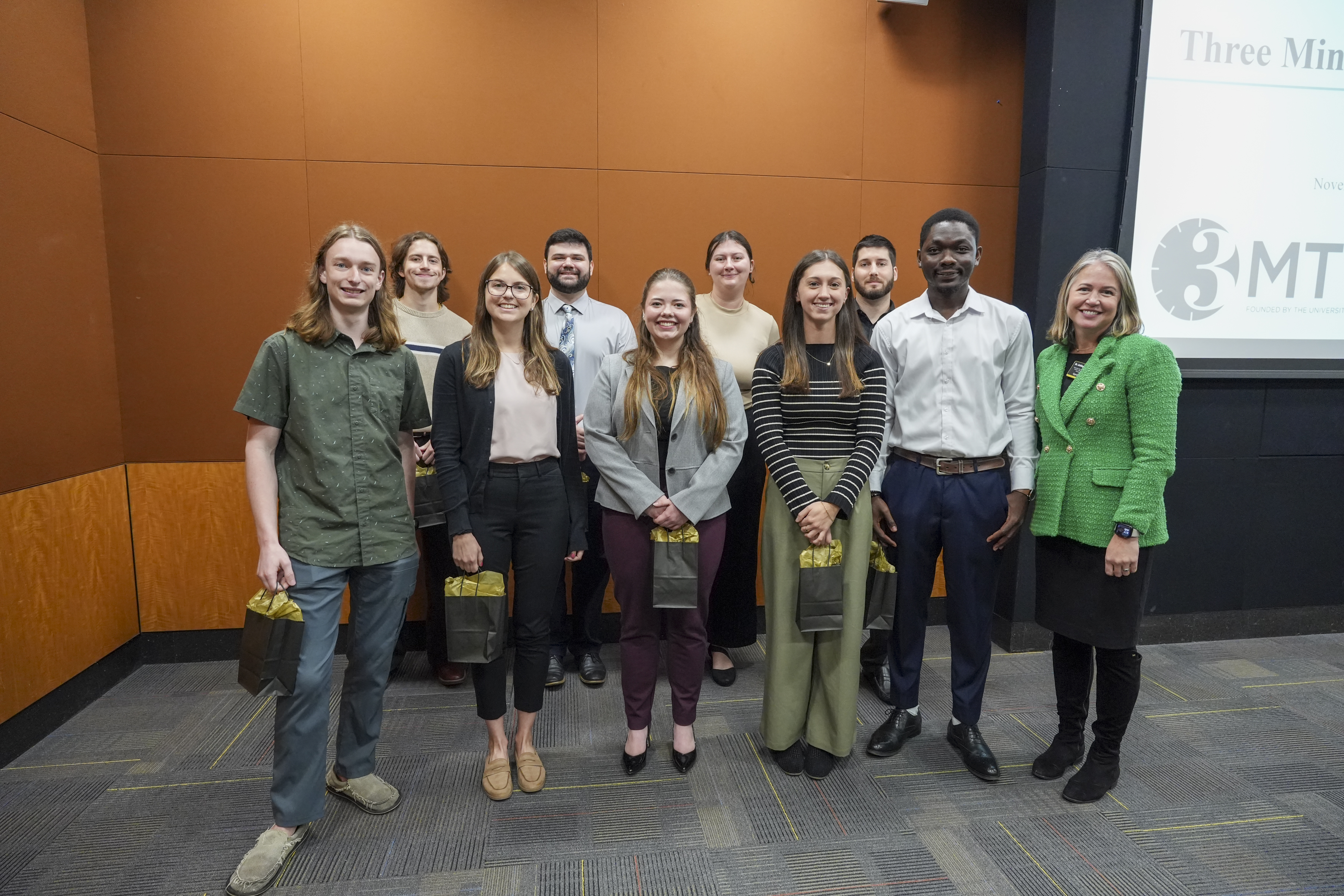 The Fall 2025 3MT Finalists pose with Dr. Colquitt before the Finals begin.
