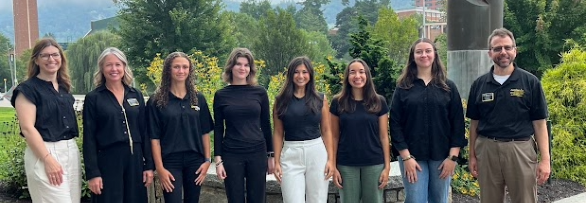 Photo outside in front of flowers of the 2025-2026 Graduate Ambassadors and Graduate School staff.